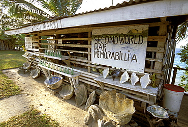 Stall selling WWII memorabilia (like old Coca-Cola bottles) and shells on the north coast. There was a large wartime American presence in Vanuatu, Efate Island, Vanuatu