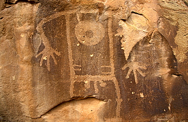 Petroglyph of male figure carved 1000 years ago by Fremont Native American people in the iron oxide 'desert varnish' on the sandstone of Cub Creek Valley in this fossil park, Dinosaur National Monument, Utah, United States of America (USA), North America