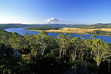 Looking north from Brady's Lookout State Reserve towards the Tamar River and a bush fire on horizon  in the state's premier wine region, the Tamar Valley, Tasmania, Australia, Pacific