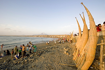 'Caballitos (little horses) de totora' reed boats on the beach  at the popular far north coast fishing & surfing village of Huanchaco, near Trujillo, Peru, South America.