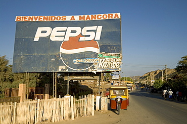 'Welcome to Mancora' sign on the Pan-American Highway and main street at this surfing resort in the far north near the Ecuadorean border, Mancora, Peru, South America