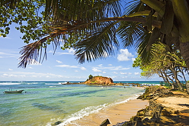 The eastern point of this beautiful south coast whale watching surf beach at Mirissa, Matara, Southern Province, Sri Lanka, Asia