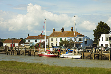 Looking across River Blyth towards houses and moored yachts on the Southwold bank, Walberswick, Suffolk, England, United Kingdom, Europe