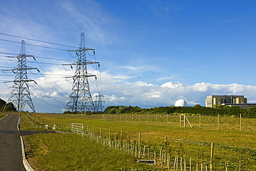 Pylons and the Sizewell A nuclear power station on the right, now closed, and the domed Sizewell B pressurised water reactor, Sizewell, Suffolk, England, United Kingdom, Europe