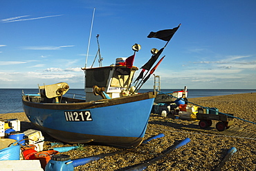 Fishing boat and nets on the seafront shingle beach of this popular unspoiled seaside town, Aldeburgh, Suffolk, England, United Kingdom, Europe