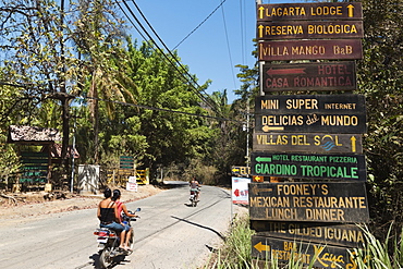 Signs for tourists near popular Playa Guiones beach, Nosara, Nicoya Peninsula, Guanacaste Province, Costa Rica, Central America