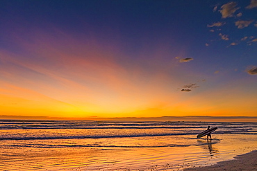 Sunset & surfer at Playa Guiones beach, Nosara, Nicoya Peninsula, Guanacaste Province, Costa Rica, Central America