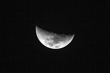 Nearside half moon showing the following Maria, Crisium, Fecunditatis, Tranquilitatis and Serenitatis, seen over Nosara, Costa Rica, Central America 