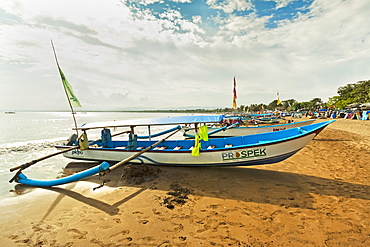 Outrigger fishing boats on west beach of the isthmus at this major beach resort on the south coast, Pangandaran, Java, Indonesia, Southeast Asia, Asia