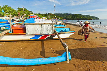 Outrigger fishing boats on west beach of the isthmus at this major beach resort on the south coast, Pangandaran, Java, Indonesia, Southeast Asia, Asia