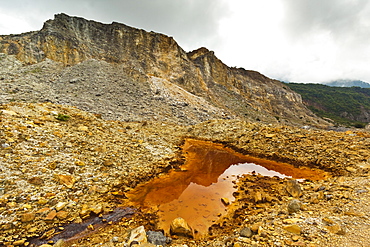 Mineral stained pond on collapsed flank of Papandayan Volcano, an active four crater caldera, Garut, West Java, Java, Indonesia, Southeast Asia, Asia