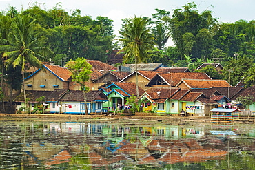 Traditional homes and Situ Cangkuang lake at this village known for its Hindu temple, Kampung Pulo, Garut, West Java, Indonesia, Southeast Asia, Asia