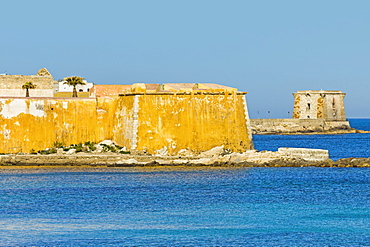 Old city walls and Tower of Ligny dating from 1671, now a Museum of Prehistory, on sea front of this northwest fishing port, Trapani, Sicily, Italy, Mediterranean, Europe