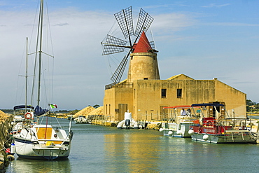 The 16th century windmill at the Ettore and Infersa Saltworks by the Stagnone Lagoon salt pan area south of Trapani, Marsala, Sicily, Italy, Mediterranean, Europe