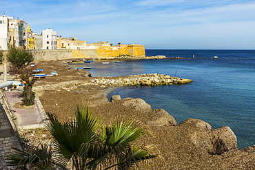 Protected cove and city walls seen from Via Mura Di Tramontana Ovest on sea front of this northwest fishing port, Trapani, Sicily, Italy, Mediterranean, Europe