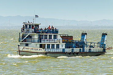 Ferry heading from San Jorge to Omotepe Island, carrying tourists, locals and  freight, Isla Omotepe, Lake Nicaragua, Nicaragua, Central America