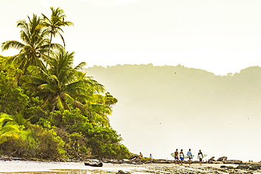 Surfers strolling on the beach at this hip southern Nicoya Peninsula surf resort, Santa Teresa, Puntarenas, Costa Rica, Central America