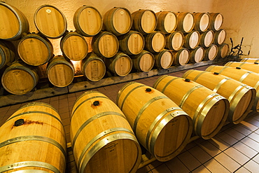 Grand Cru wine barrels at Chateau Cantenac near this old town and famous Bordeaux red wine region, St. Emilion, Gironde, France, Europe