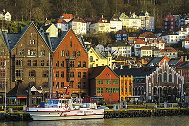 Wooden Hanseatic Museum and castellated Kjottbasaren shopping centre on right on the Bryggen waterfront, UNESCO World Heritage Site, Bergen, Hordaland, Norway, Scandinavia, Europe