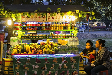 Fruit and drink stall at the Art Center Night Market by the Siem Reap River in this north west tourist town, Siem Reap, Cambodia, Indochina, Southeast Asia, Asia