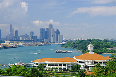 Ferry terminal of popular island resort with Keppel Harbour and the city in the background, Sentosa Island, Singapore