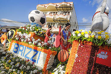 Women on a bank's large float at the annual Tomohon International Flower Festival parade, Tomohon, North Sulawesi, Sulawesi, Indonesia, Southeast Asia, Asia