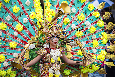 Girl in elaborate peacock style costume at the annual Tomohon International Flower Festival parade, Tomohon, North Sulawesi, Sulawesi, Indonesia, Southeast Asia, Asia