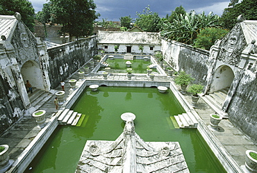 Swimming pools where the court princesses would bathe, at Taman Sari, the Water Castle, a vast pleasure palace built in 1761 by Sultan Hamengku Buwono I, Yogyakarta, Central Java, Indonesia, Asia