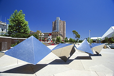 Modern sculpture between Parliament House and the Festival Centre on North Terrace at the heart of South Australia's capital with the Hyatt Hotel beyond, Adelaide, South Australia, Australia, Pacific