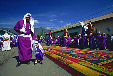 One of the famous Easter processions, with road carpeted with coloured sawdust, Antigua, Guatemala, Central America