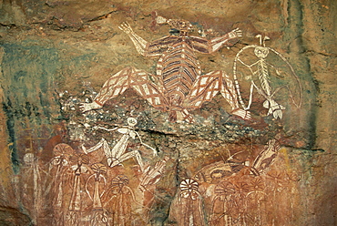 Namondjok in centre, who ate his clan sister, Namarrgon on right the Lightning Man and Barrginj his wife below left, supernatural ancestors at the rock art site, Nourlangie Rock, Kakadu National Park, UNESCO World Heritage site, Northern Territory, Australia, Pacific