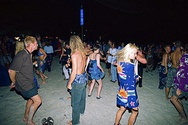 Tourists dancing at a full moon party at Haad Rin Beach at Koh Pha Ngan in Thailand, Southeast Asia Asia