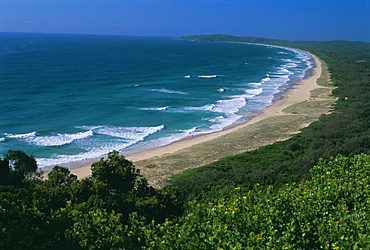 Looking south from Cape Byron to Tallow Beach, a surfing spot east of the resort of Byron Bay in the northeast of New South Wales, Australia