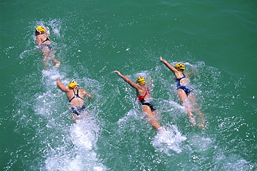 Competitors in the Henley and Grange swimming race that is swum between the piers of these two neighbouring seaside suburbs of Adelaide, South Australia, Australia, Pacific