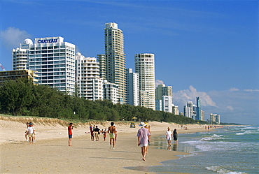 Morning walkers on the beach at the resort of Surfers Paradise on the Gold Coast of Queensland, Australia, Pacific