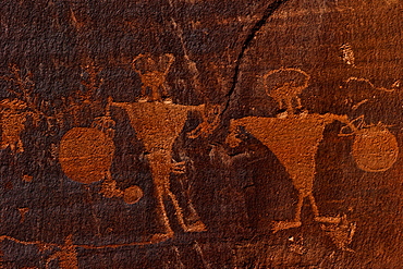 Horned anthropomorphs holding shields, Formative Period Petroglyphs, Utah Scenic Byway 279, Potash Road, Moab, Utah, United States of America, North America 