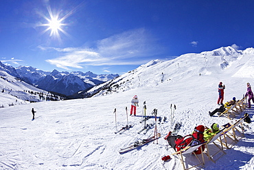 Skiers relaxing at cafe in winter sunshine, Verdons Sud, La Plagne, French Alps, France, Europe 