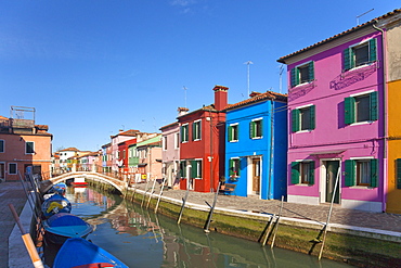 Brightly coloured houses along canal in Burano town, Venice Lagoon Island, Veneto, Italy, Europe