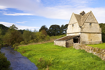 A 16th century stone Dovecote, River WIndrush, Naunton,  Cotswolds. Gloucestershire, England, United Kingdom, Europe