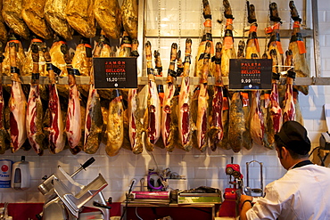 Cured hams (jamon serrano), for sale in market of Mercado de San Miquel, Madrid, Spain, Europe