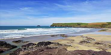 View of Atlantic surf at Polzeath beach, looking north to Pentire Headland, North Cornwall, England, United Kingdom, Europe