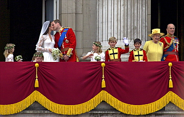 Prince William kisses his new wife Catherine Duchess of Cambridge during their public appearance on the balcony of Buckingham Palace, on their wedding day, London, England, United Kingdom, Europe