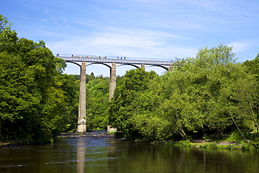 Barge and pedestrians on the Pontcysyllte Aqueduct, UNESCO World Heritage Site, built by Thomas Telford in 1805, crossing River Dee near Llangollen, Wales, United Kingdom, Europe