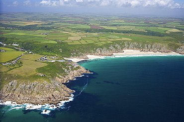 Aerial photo of Lands End Peninsula looking east to the Minnack Theatre and Porthcurno beach, West Penwith, Cornwall, England, United Kingdom, Europe