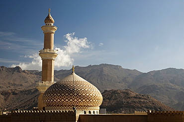 Sultan Quaboos Mosque with mountains and cloud at back, Nizwa, Oman, Middle East