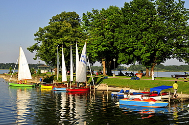 Colourful sailing boats in the harbor of Prien on Lake Chiemsee, Chiemgau, Bavaria, Germany, Europe