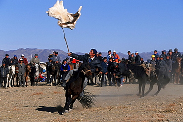 Kek Bar, game similar to the Buzkashi, Horsemen competing for a goat skin, Golden Eagle Festival, Bayan Oelgii, Altai Mountains, Mongolia, Asia