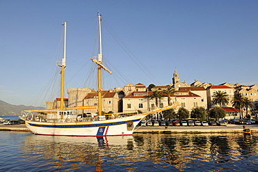 Sailboat and historic town of Korcula, Croatia, Europe