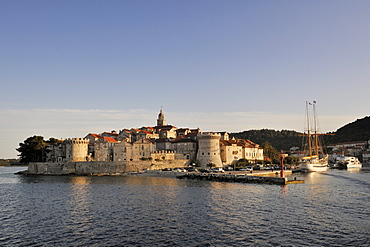 Sailboat and historic town of Korcula, Croatia, Europe