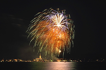 Fireworks on the shores of Lake Constance with the city of Radolfzell and the Cathedral of Our Lady, Landkreis Konstanz county, Baden-Wuerttemberg, Germany, Europe